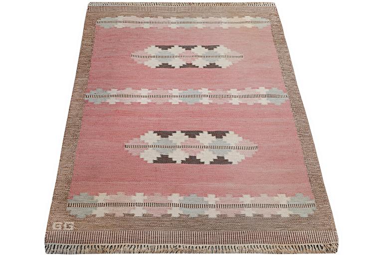 A flat weave carpet, signed GG, c. 190 x 133 cm.
