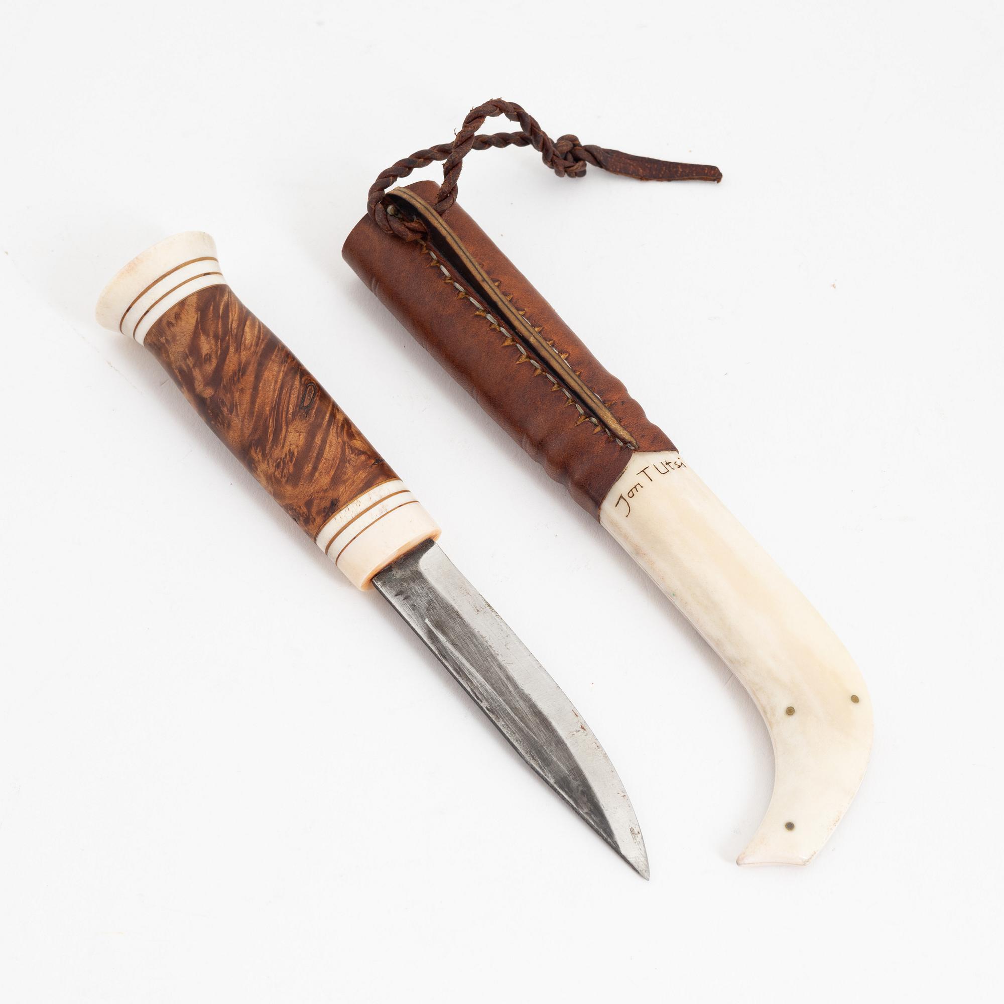 Jon Tomas Utsi, a reindeer horn knife, signed Jon T Utsi.