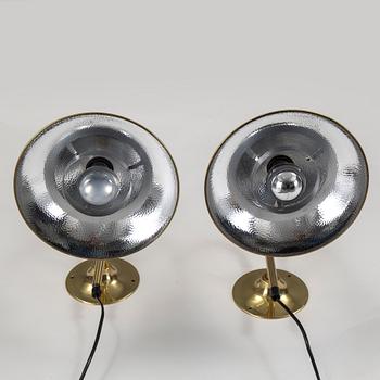 A pair of brass wall lamps by Börje Claes, late 20th century.