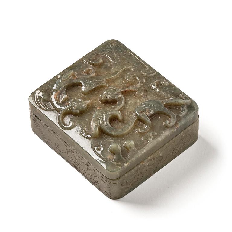 A well carved green stone box with cover, China, 20th century.