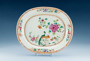 1574. A famille rose 'double peacock' serving dish, Qing dynasty, Qianlong (1736-95).