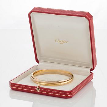 A Cartier "Trinity" bangle.