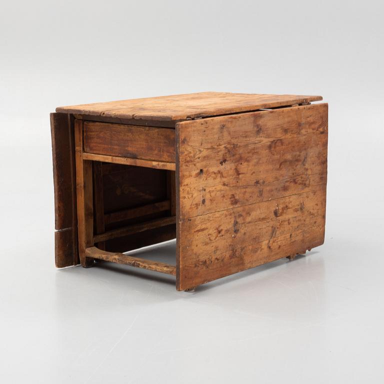 A 19th century gate-legged table.