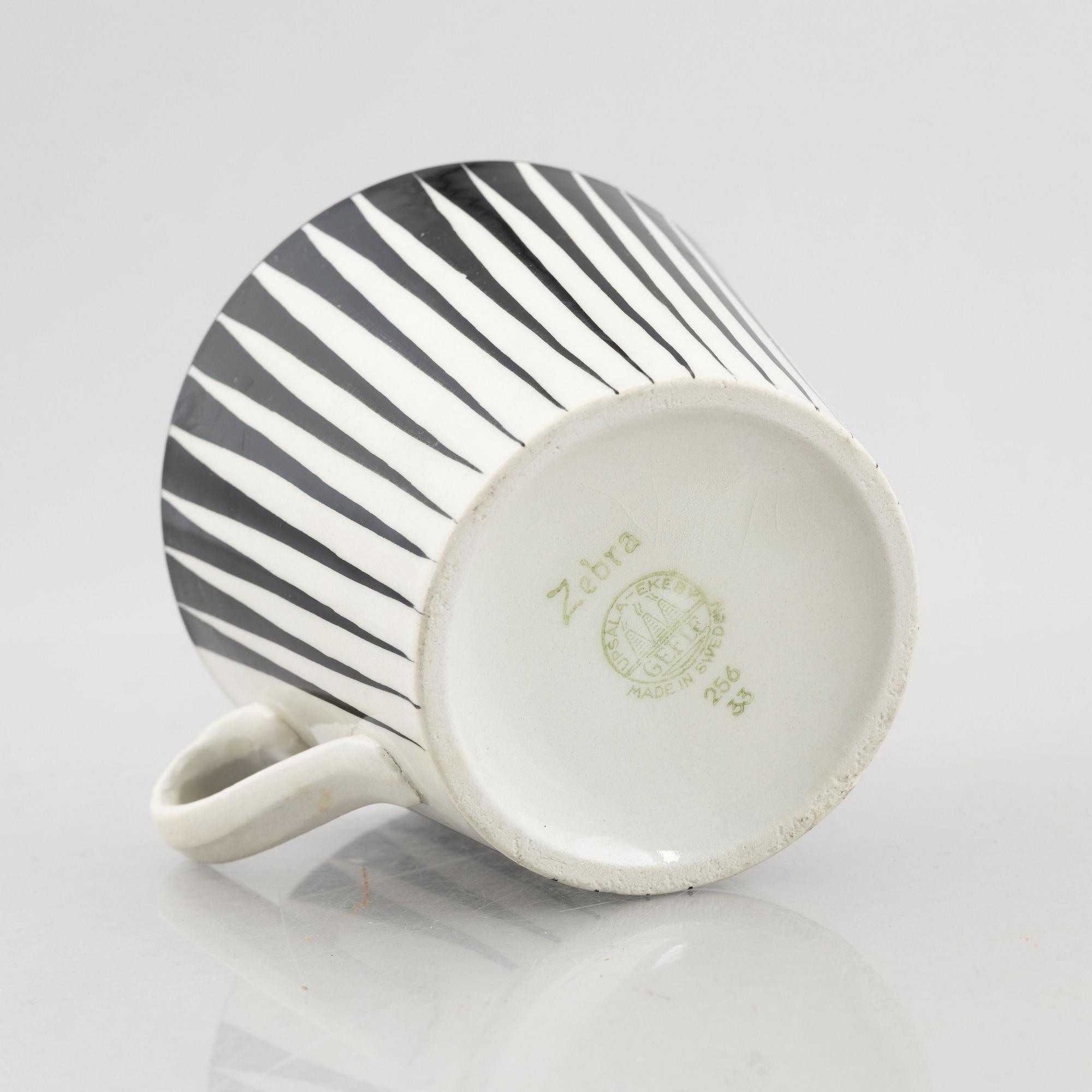 Eugen Trost, three creamware coffee cups with saucers and four tea cups with saucers, "Zebra", Upsala-Ekeby, Sweden.
