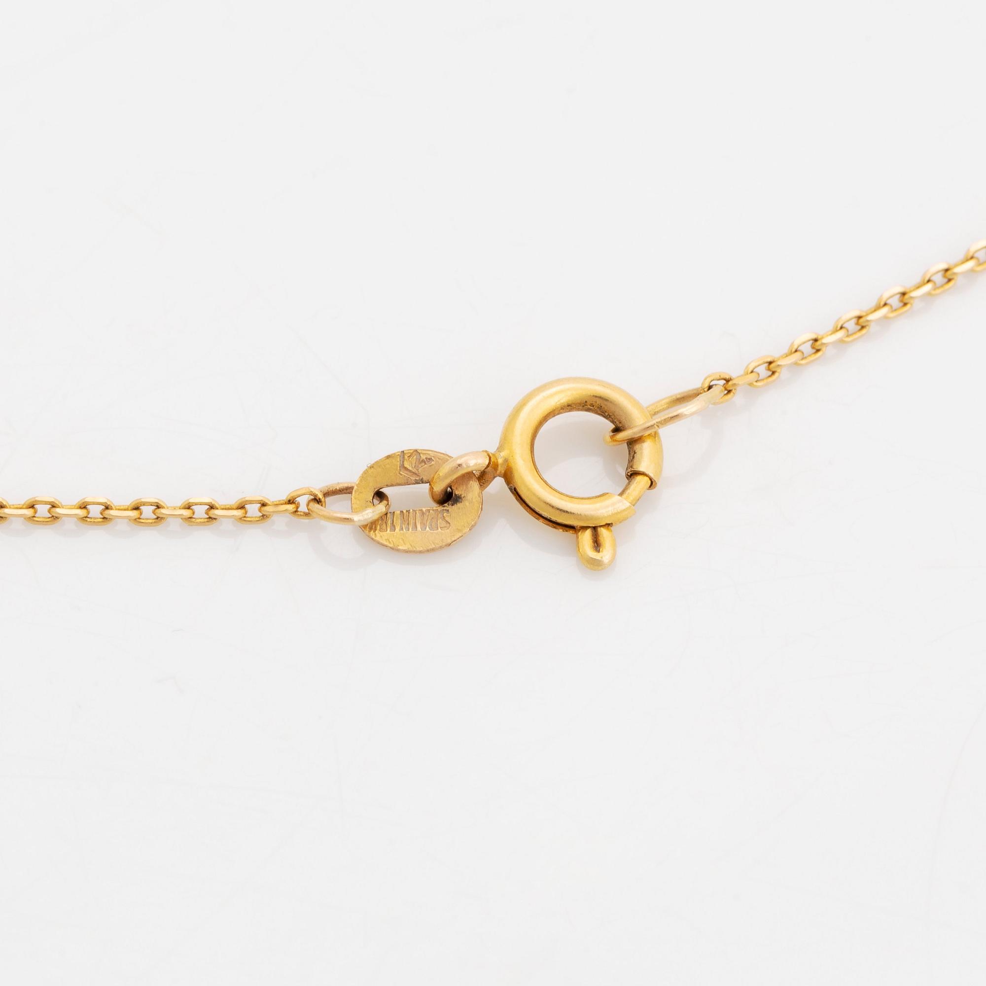 An 18K gold pendant set with faceted aquamarine and pearls.