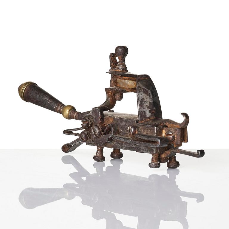 A mechanical flintlock igniter, later part 18th century/early19th century.