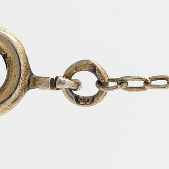 A gilded silver bracelet and necklace with garnets.