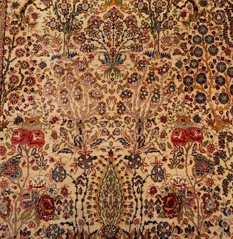 A CARPET, a semi-antique Tabriz probably, figural, ca 325,5 x 226 cm.