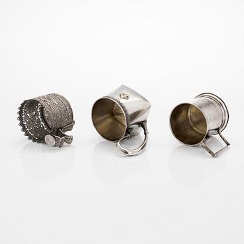 Three silver tea glass holders and four spoons, silver Kostroma and Moscow, late 19th and early 20th centuries.