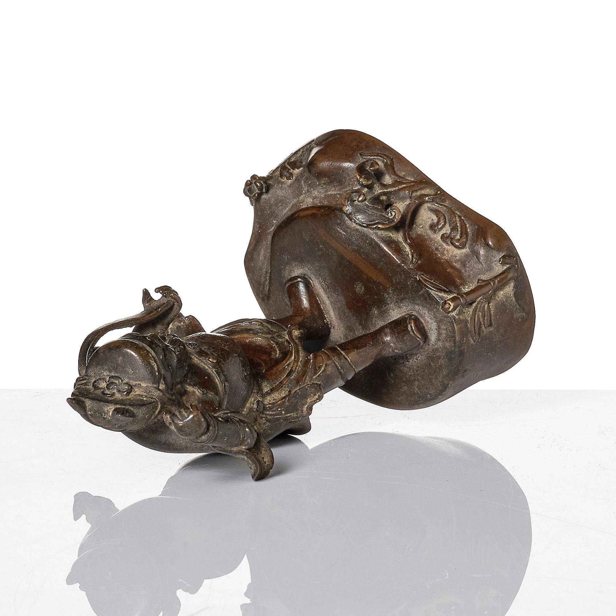 A bronze sculpture of a man with a tablet, Ming dynasty (1368-1644).