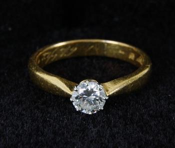 RING, 23K guld med briljant ca 0,25ct.