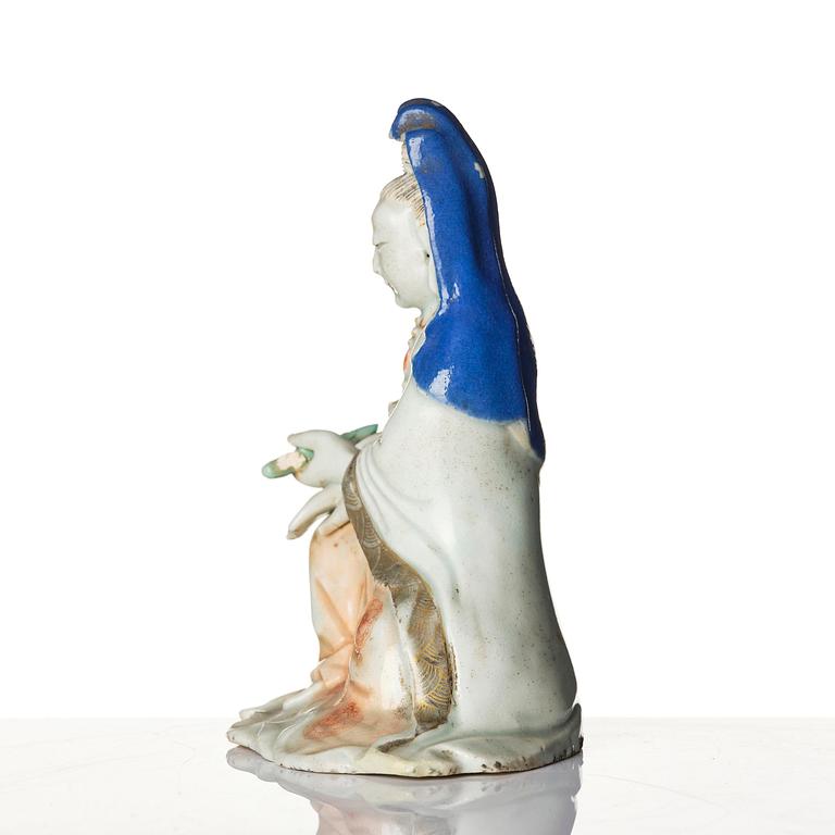 A porcelain figure of Guanyin, Qing dynasty, (1736-95).