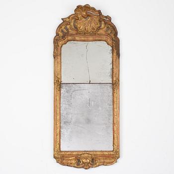 A Swedish rococo giltwood mirror in the manner of E. Göbel, Stockholm, later part 18th century.