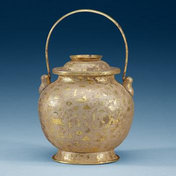 A gilt silver jar with cover and handle, presumably Tang dynasty.