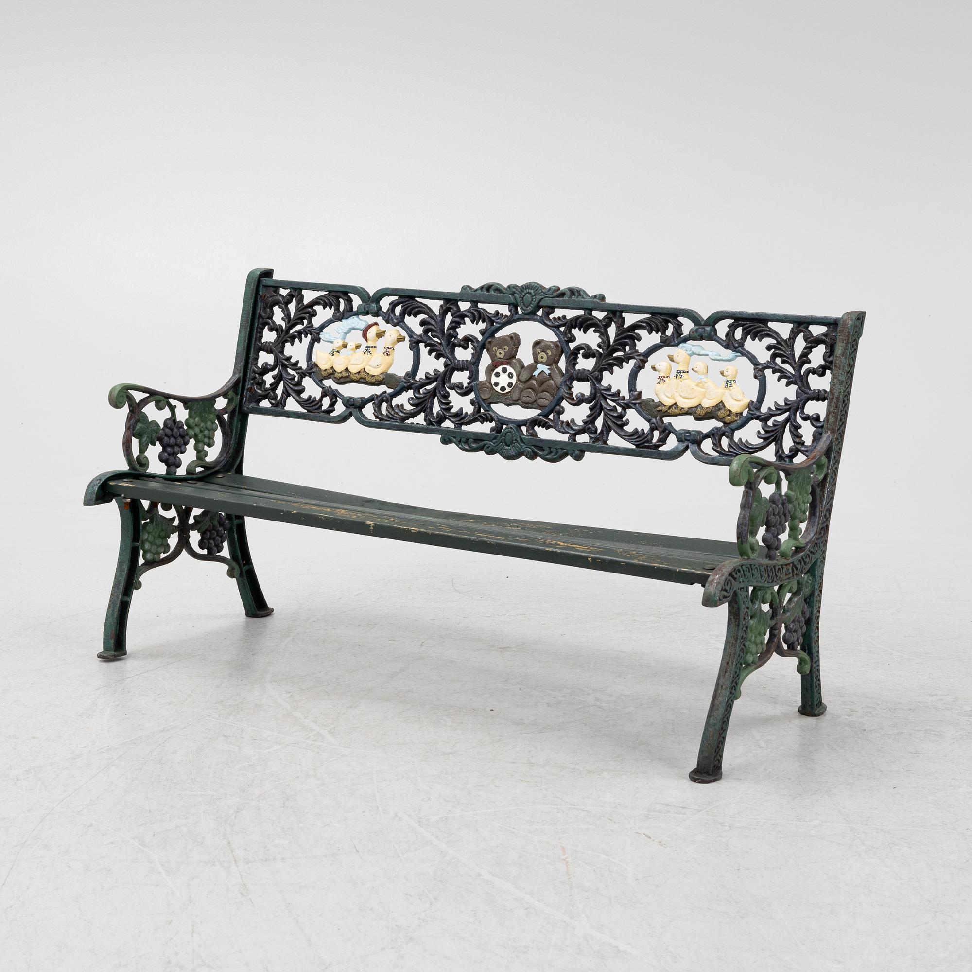 A children's cast iron garden sofa and armchair, mid 20th century.