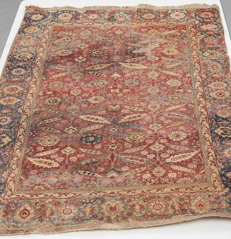 A MUGHAL RUG, an antique Indian, the second half of the 17th century, ca 191-198,5 x 126,5-127,5 cm.