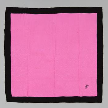 A silk scarf by Yves Saint Laurent.