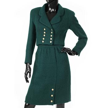 CHANEL, a two-piece suit consisting of short jacket and skirt.