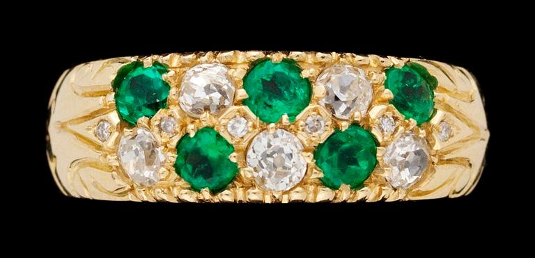 An emerald and diamond gold ring.