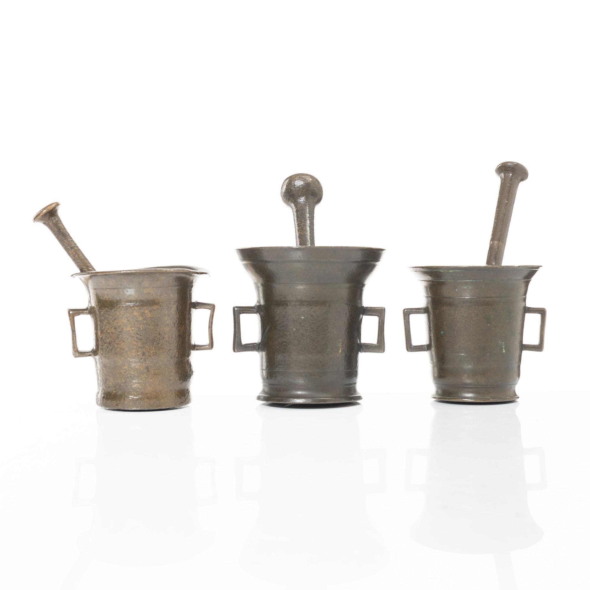 A set of three brass mortars with pestles, later part 18th century / early 19th century.