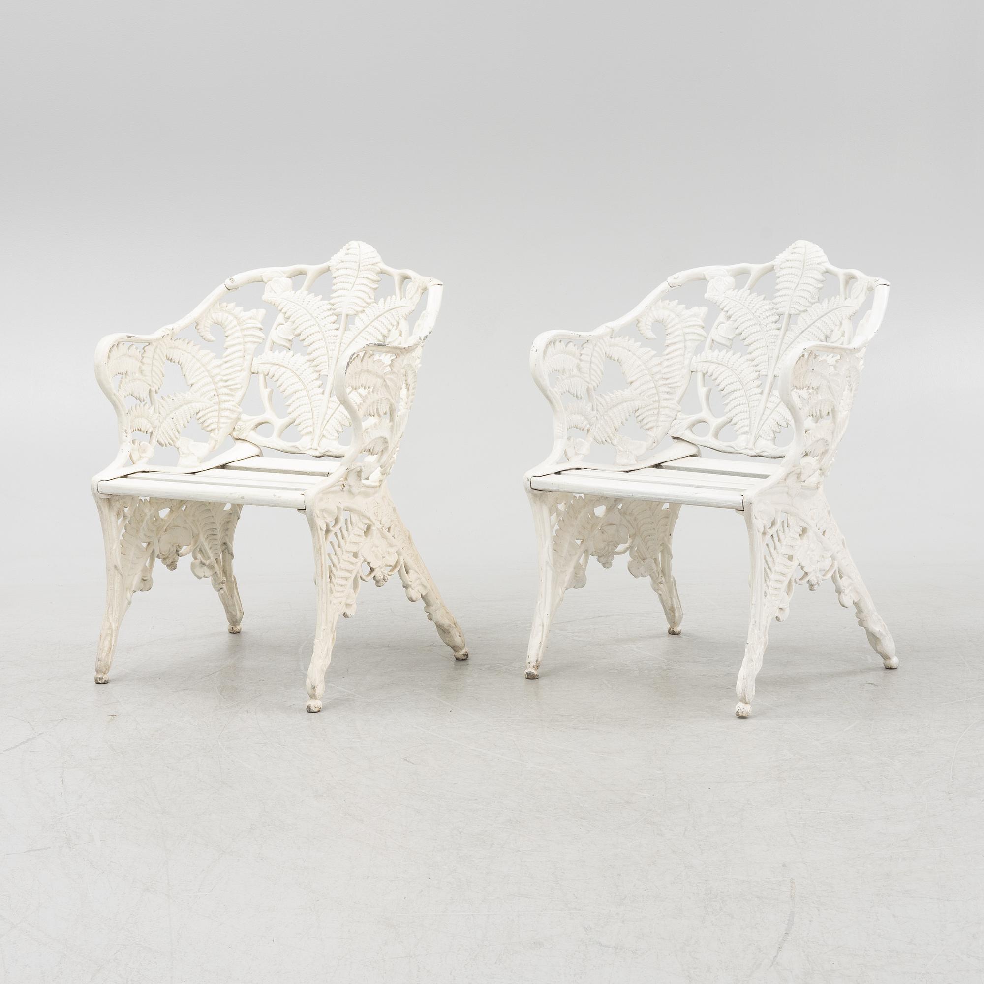 A pair of painted aluminum armchairs, second part of the 20th Century.