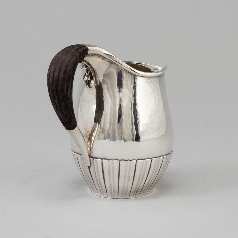 A"Cosmos", cream jug, sterling silver. Designed by Johan Rodhe for Georg Jensen, modell no 45E, weight 175 grams.