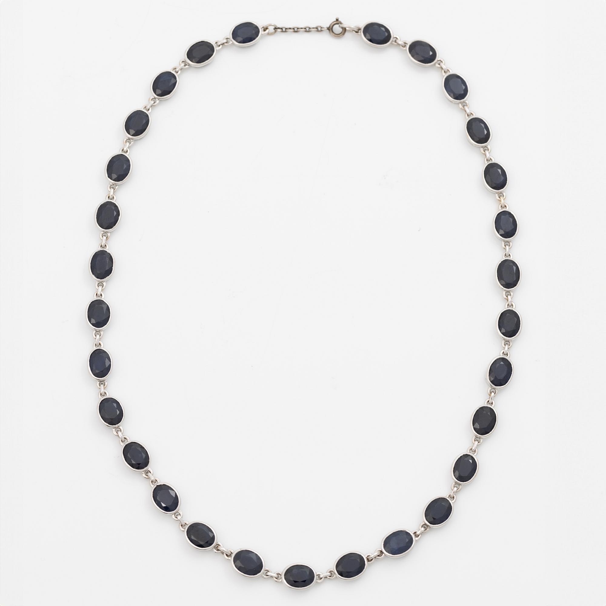 18K white gold necklace with dark sapphires.