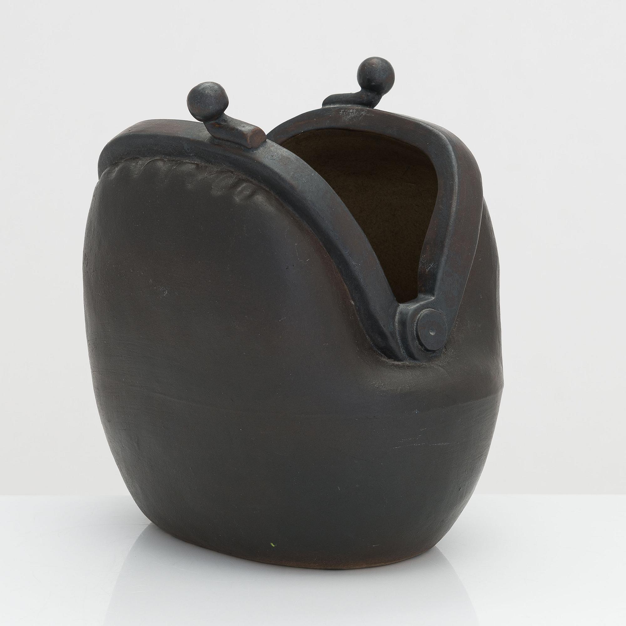 Outi Leinonen, a ceramic vase formed as a purse for Pentik, Finland.