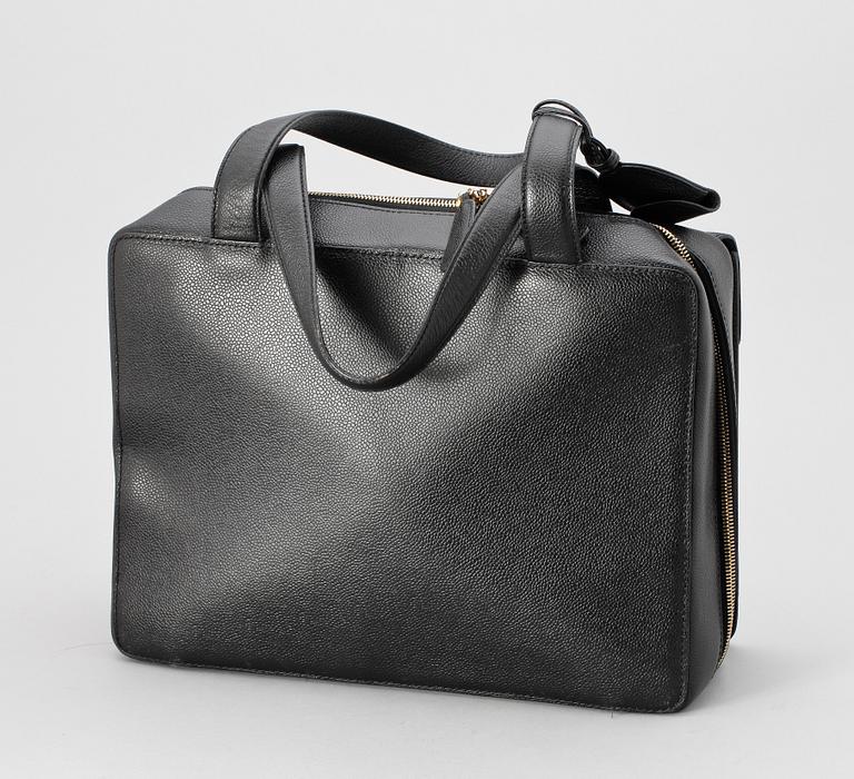 A 21th cent black "caviar" leather beautybox/weekendbag by Chanel.