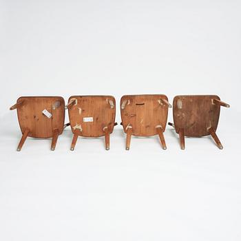 Axel Einar Hjorth, a set of four stained pine "Utö" chairs, Nordiska Kompaniet, Sweden 1930s.