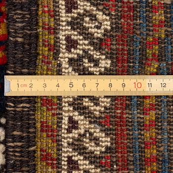 An antique Baluch rug, east Persian, ca 203 x 101 cm.