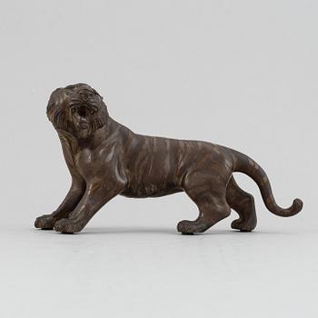 A Japanese bronze okimono in the shape of a tiger, Meiji period (1868-1912), late 19th century. Signed 'Mitani'.