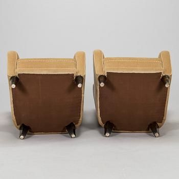A pair of mid-20th century armchairs.