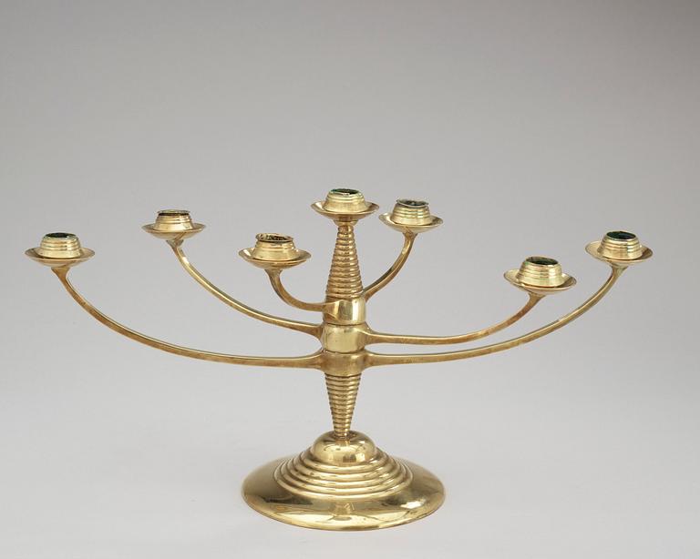 A brass candelabrum after Bruno Paul, Germany, early 20th C.