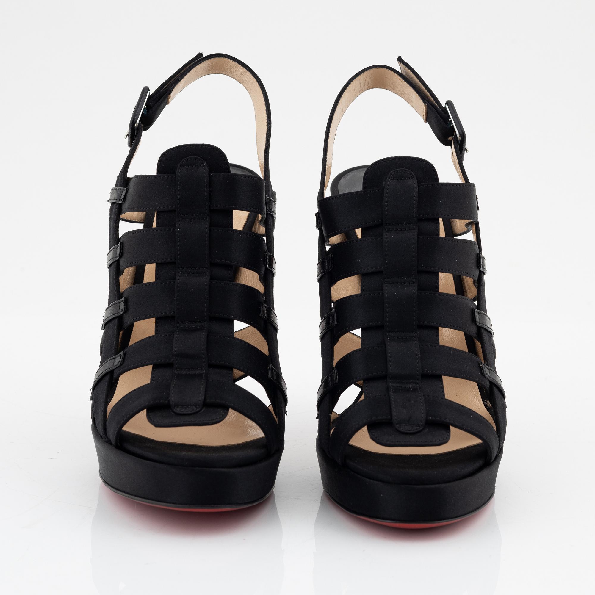 Christian Louboutin, a pair of black silk sandals, size 37 1/2.