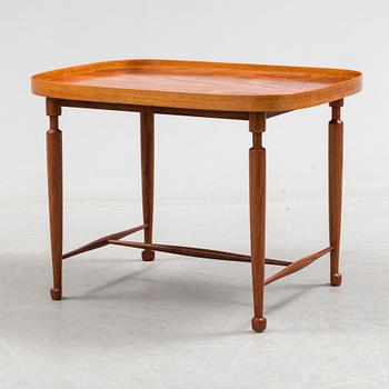 A mahogany veneered model 974 side table from Svenskt Tenn.