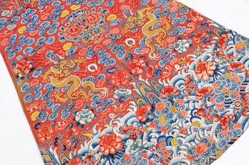 An embroidered red ground five clawed dragon 'female' formal robe, Qing dynasty, 19th century.