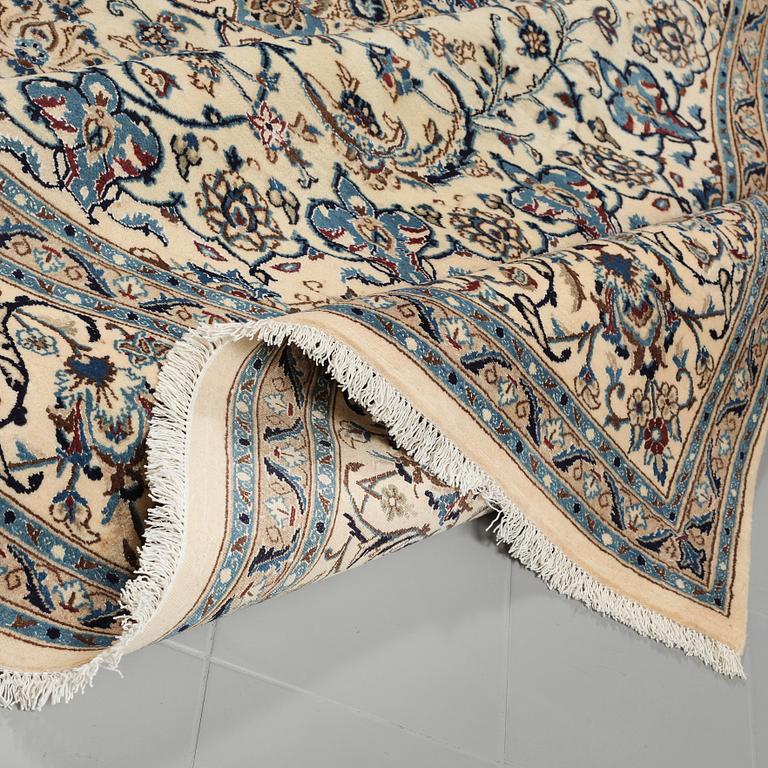 A Nain rug, part silk, 382 x 301 cm.