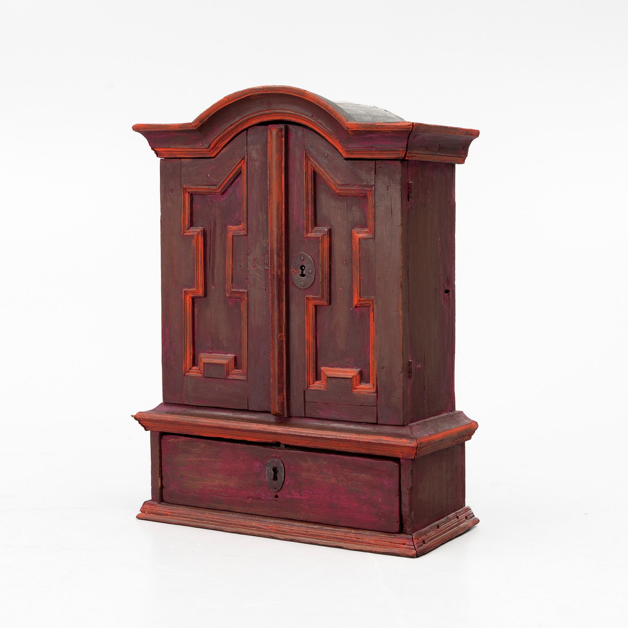 A 18th century Swedish wall-hanged cabinet.