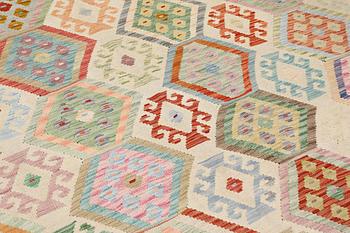 A Kilim rug, approx. 299 x 245 cm.