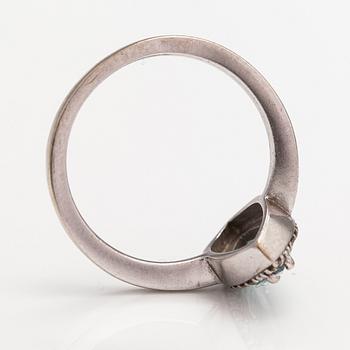 A 14K white gold ring with a topaz and diamonds ca. 0.12 ct in total. Faber art, Helsinki.