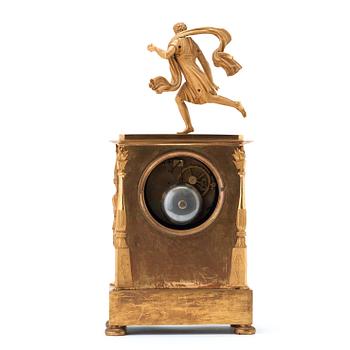 A French Empire gilt bronze mantel clock by M Sirost, master from 1806.