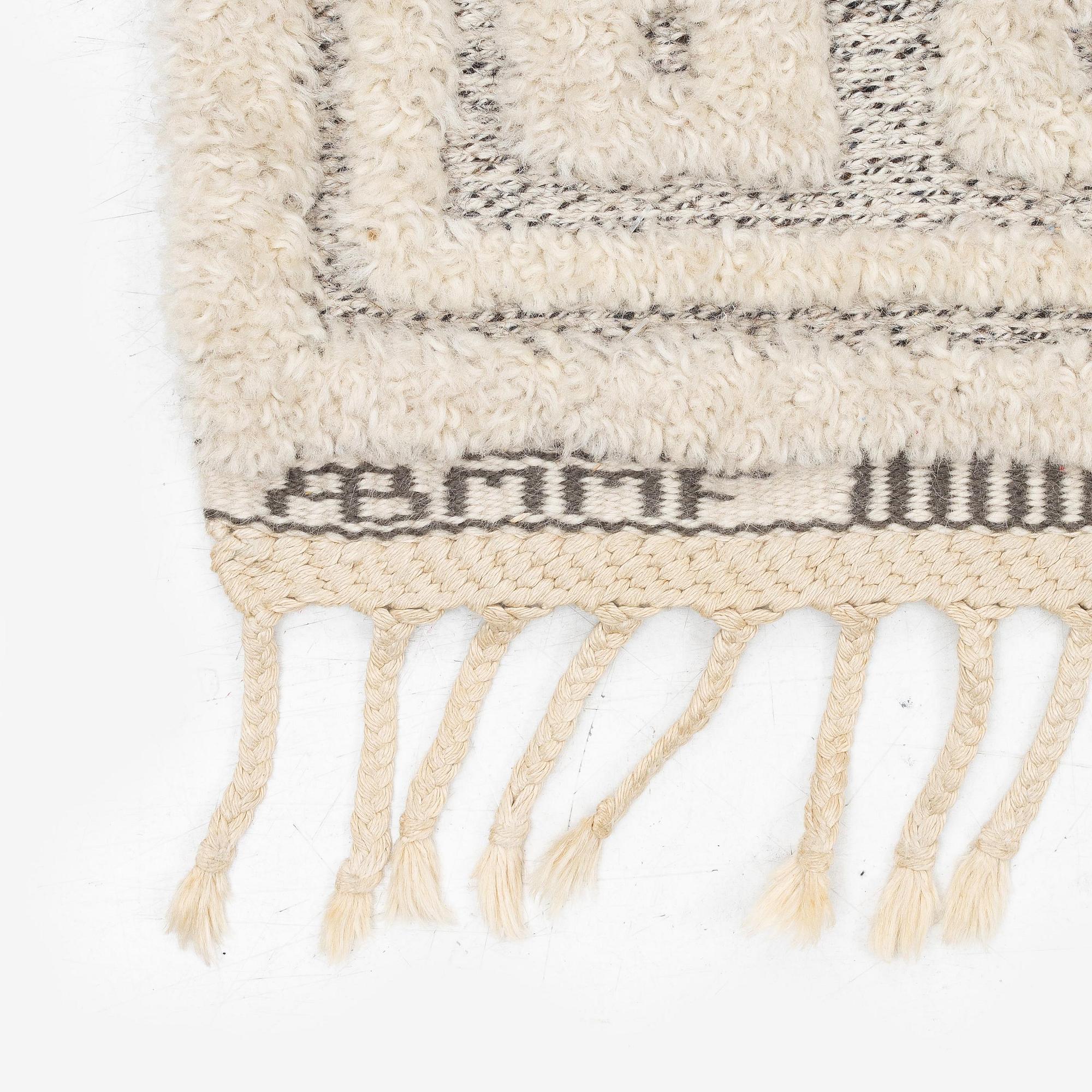 Märta Måås-Fjetterström, a 'Vita spetsporten' carpet, knotted pile in relief,  c. 218 x 119 cm, signed AB MMF,