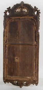 A Rococo mirror, 18th century.