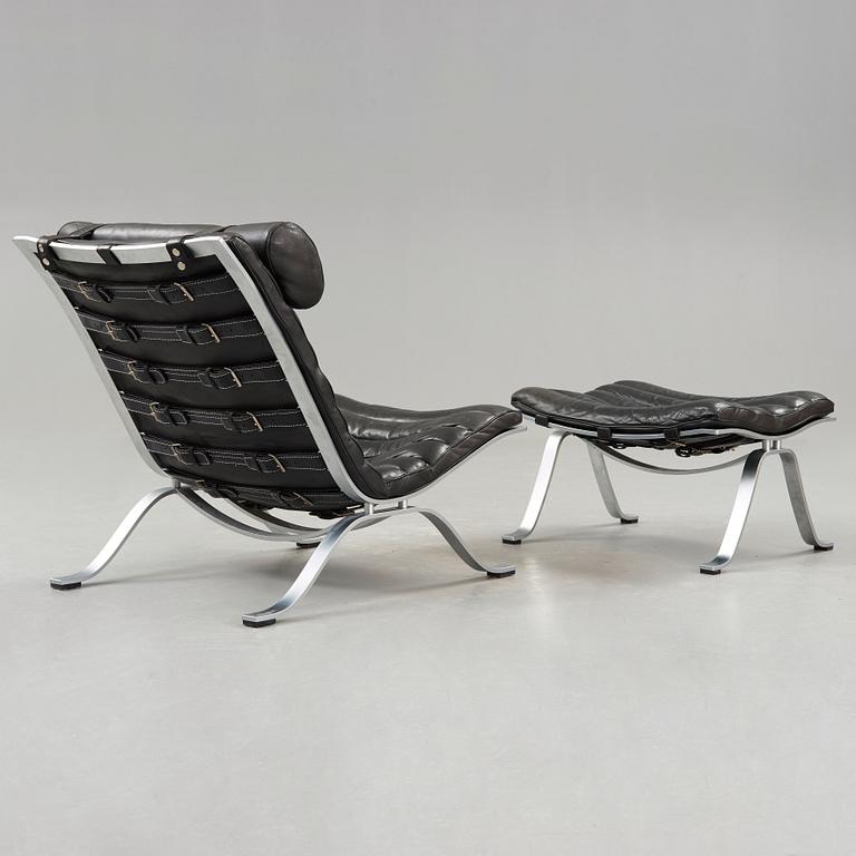 Arne Norell, an 'Ari' steel and black leather lounge chair with ottoman, Norell, Sweden.