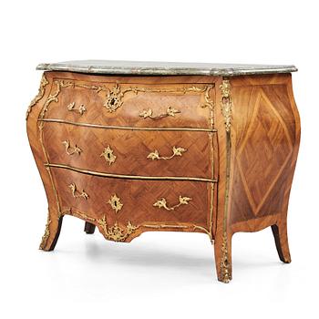 A rococo parquetry and gilt brass-mounted commode by J. J. Eisenbletter (active ca 1760-1810).