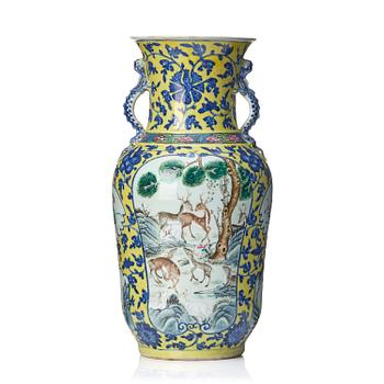 1280. A famille rose yellow ground vase, late Qing dynasty.