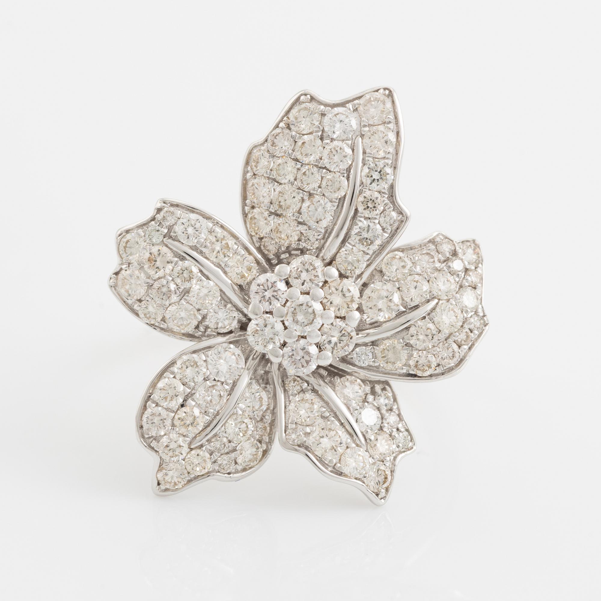 Brilliant cut diamond flower ring.