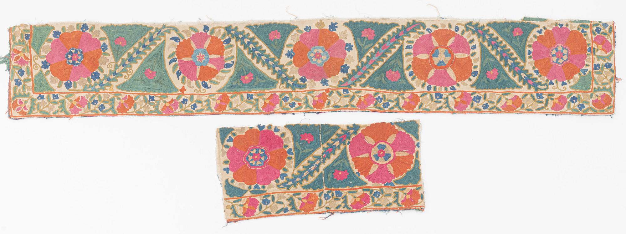 Two antique Suzani embroidery fragments, c 162 x 27.5 and 54 x 25 cm.