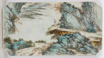 A set with four Chinese porcelain panels with a wooden frame, first half of 20th century.